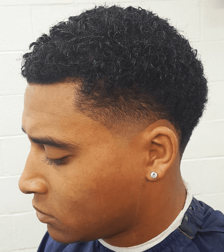 Curly top with low taper fade